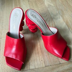 Keeyahri square toe mules with twisted heel details